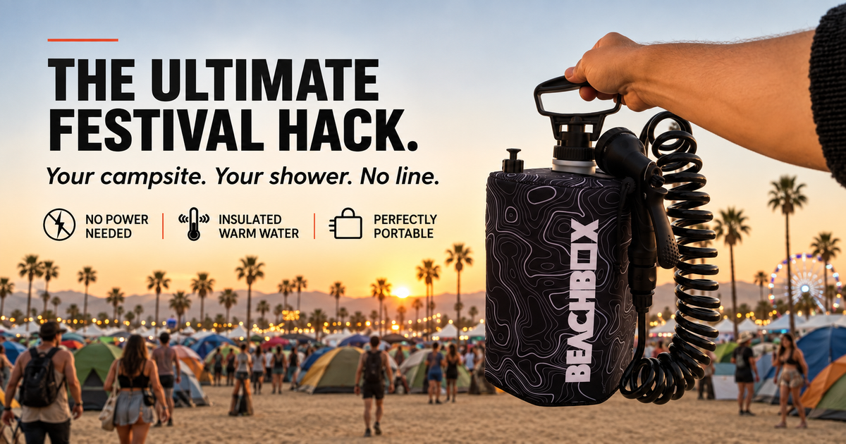 Black BeachBox portable shower tank held up at a festival campground, used as a festival shower.