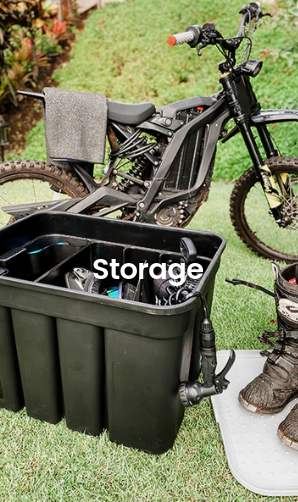 BeachBox storage box holding gear on the grass beside an electric mountain bike